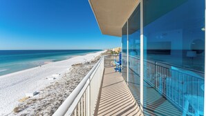 A balcony with a view of a beach and ocean. - Million$$ Panoramic Views from Wrap-Around Balcony! Free Beach Service! (Fort Walton Beach)