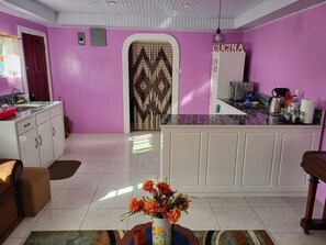 Fridge, microwave, stovetop, coffee/tea maker