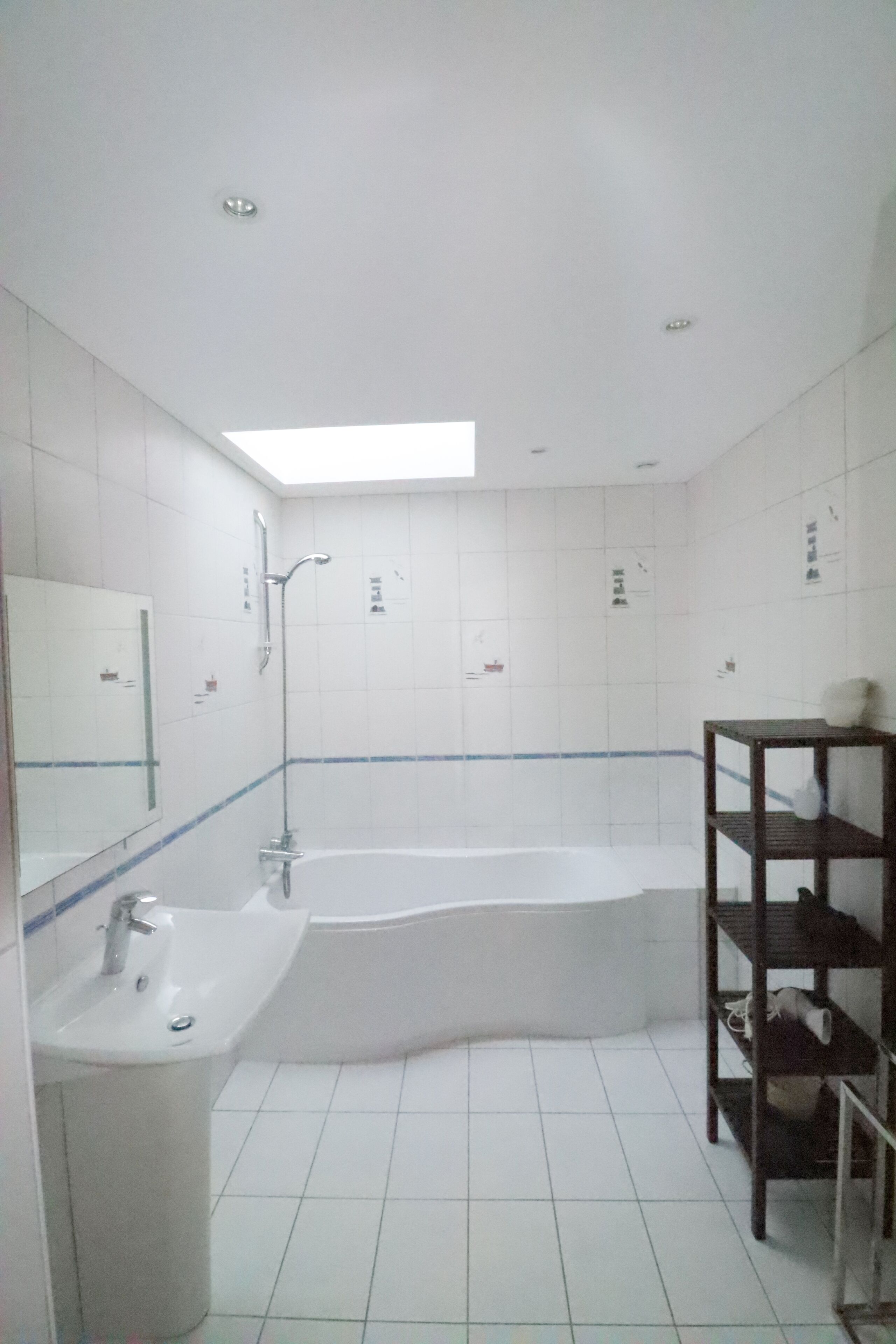 A bathroom with a sink, a bathtub, and a shower.