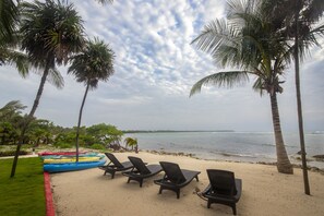 On the beach, sun-loungers, beach towels