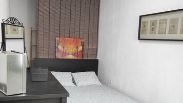 2 dormitorios, tabla de planchar con plancha, wifi y ropa de cama