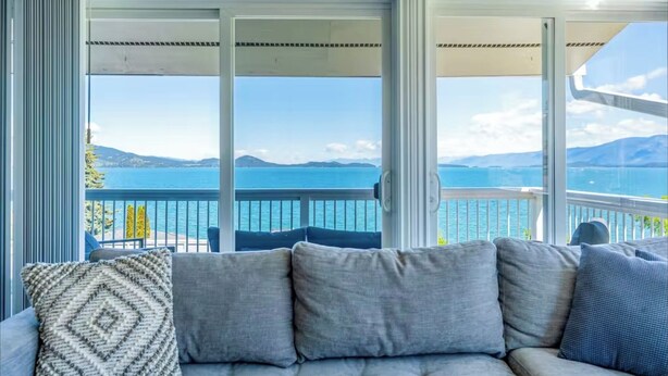 A balcony with a view of the sea and mountains. - The Flathead Overlook at Lakeplace (Polson)