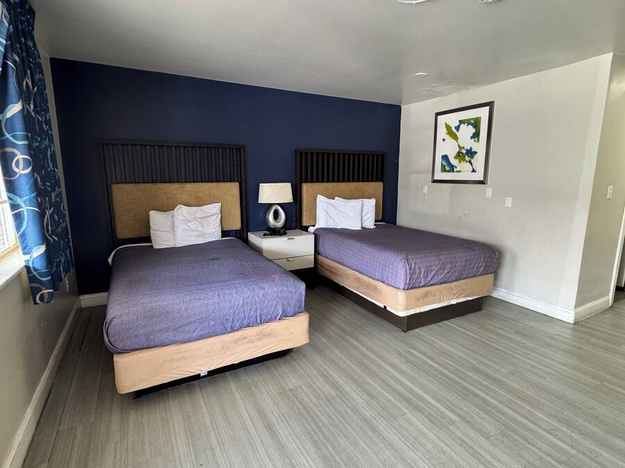 Room, 2 Queen Beds, Smoking | Hypo-allergenic bedding, desk, free WiFi, bed sheets