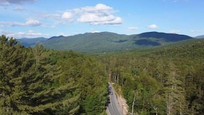 A road winding through a forested mountain area.