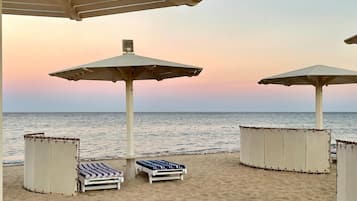 On the beach, sun loungers