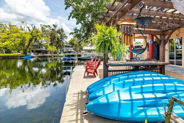 Enjoy scenic views and peaceful surroundings from this waterfront retreat, where guests can dock their boats and relax amidst lush greenery.