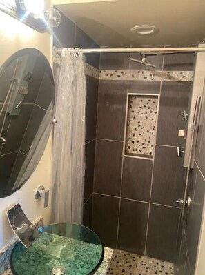 Shower, hair dryer, towels, toilet paper