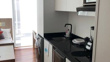 Fridge, microwave, coffee/tea maker, cookware/dishes/utensils