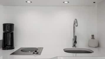 Microwave, stovetop, coffee/tea maker, cookware/dishes/utensils