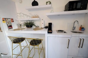 Fridge, microwave, stovetop, coffee/tea maker