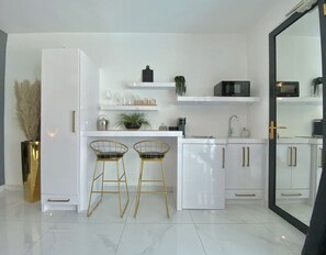 Fridge, microwave, stovetop, coffee/tea maker