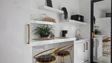 Fridge, microwave, stovetop, coffee/tea maker