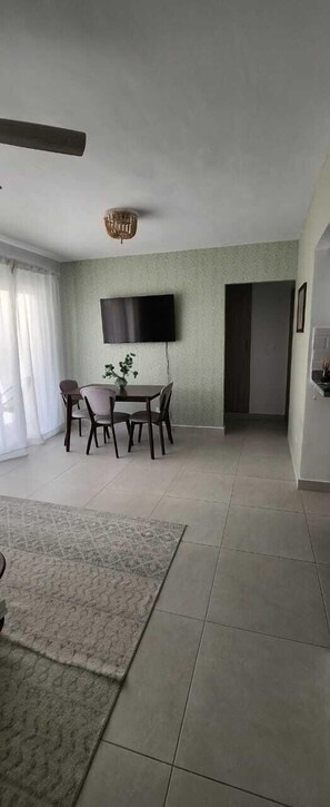 Family Apartment | Living area | 50-inch LCD TV with cable channels, TV, Netflix