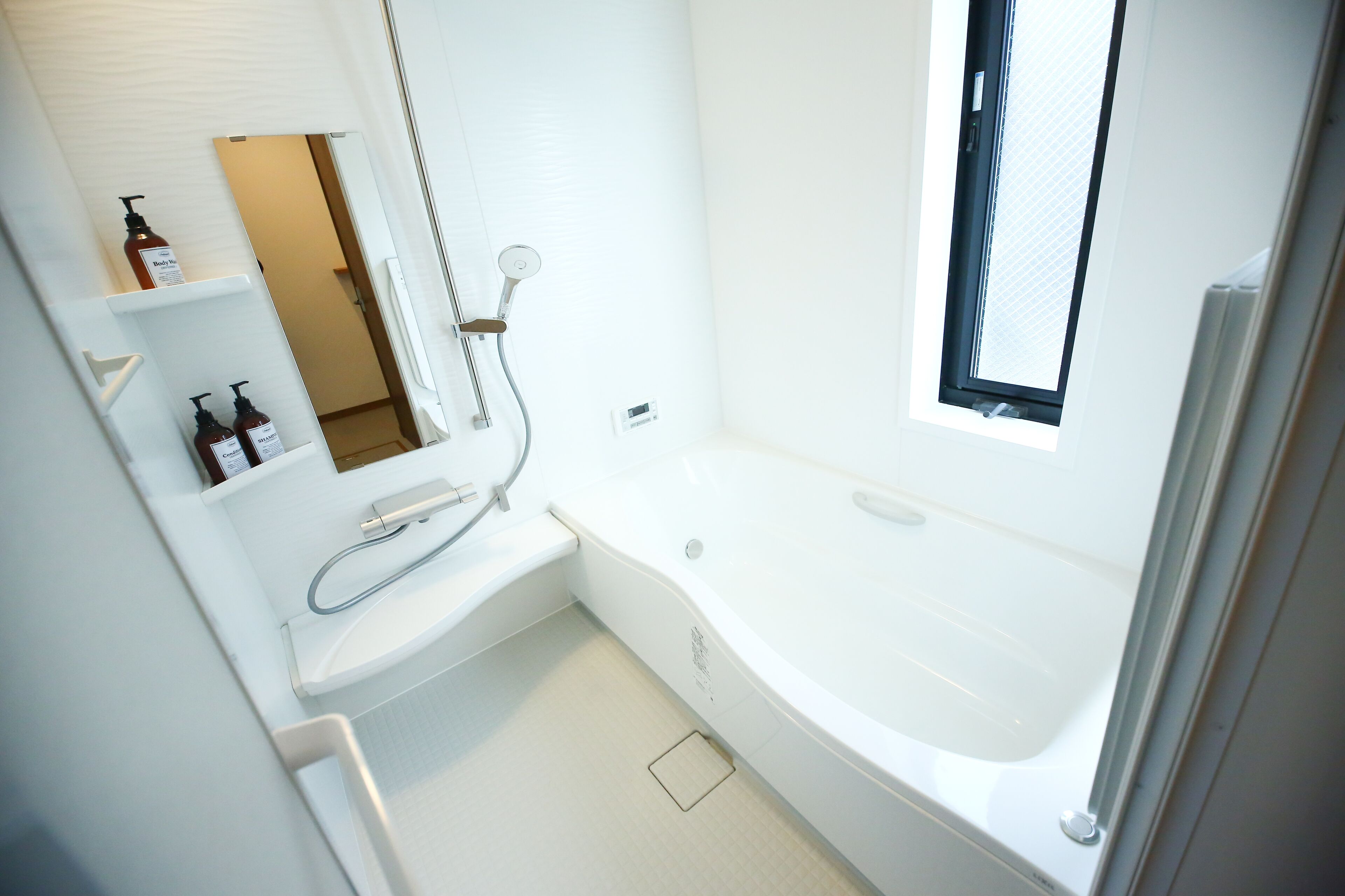 Separate bathtub and shower, towels