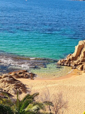 On the beach, sun-loungers