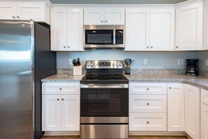 Coffee/tea maker, fridge, microwave, oven