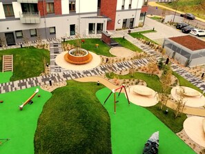 Property grounds - Family apartment, playground, parking lot. (Kołobrzeg)
