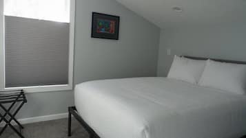 1 bedroom, desk, iron/ironing board, travel crib