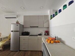 Fridge, electric kettle, cookware/dishes/utensils, dining tables - Unique Sea &City Lifestyle studio (Limassol)