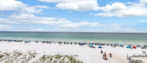 On the beach, sun-loungers