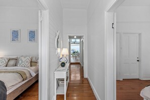 Enter a serene bedroom area with a comfortable bed and stylish decor.