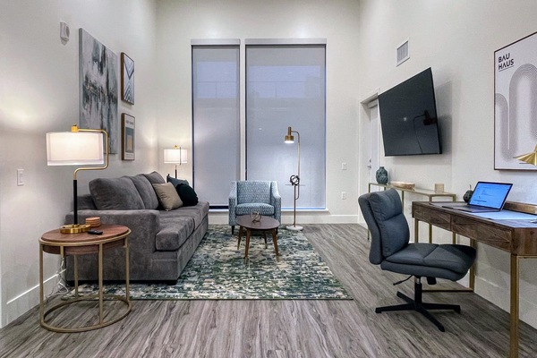 Living Room with comfy work Desk and 65" Roku 4K smart TV