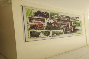 A wall with a map of Alcoy Eco-Tourism Development, including features like the Rope Course, MPB Alcoy Plaza, MudCrab Sanctuary, Boardwalk, and Fish Feeding Area. - Alcoy Plaza Eco Park Cebu (Alcoy)