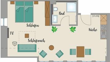 A hotel room layout with a TV, sofa, two armchairs, a small table, a bathroom, and a kitchen area.
