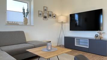 Townhome | Living area | Flat-screen TV, heated floors