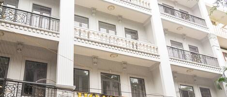 A multi-story hotel with balconies and a sign reading "HOTEL KOREA".