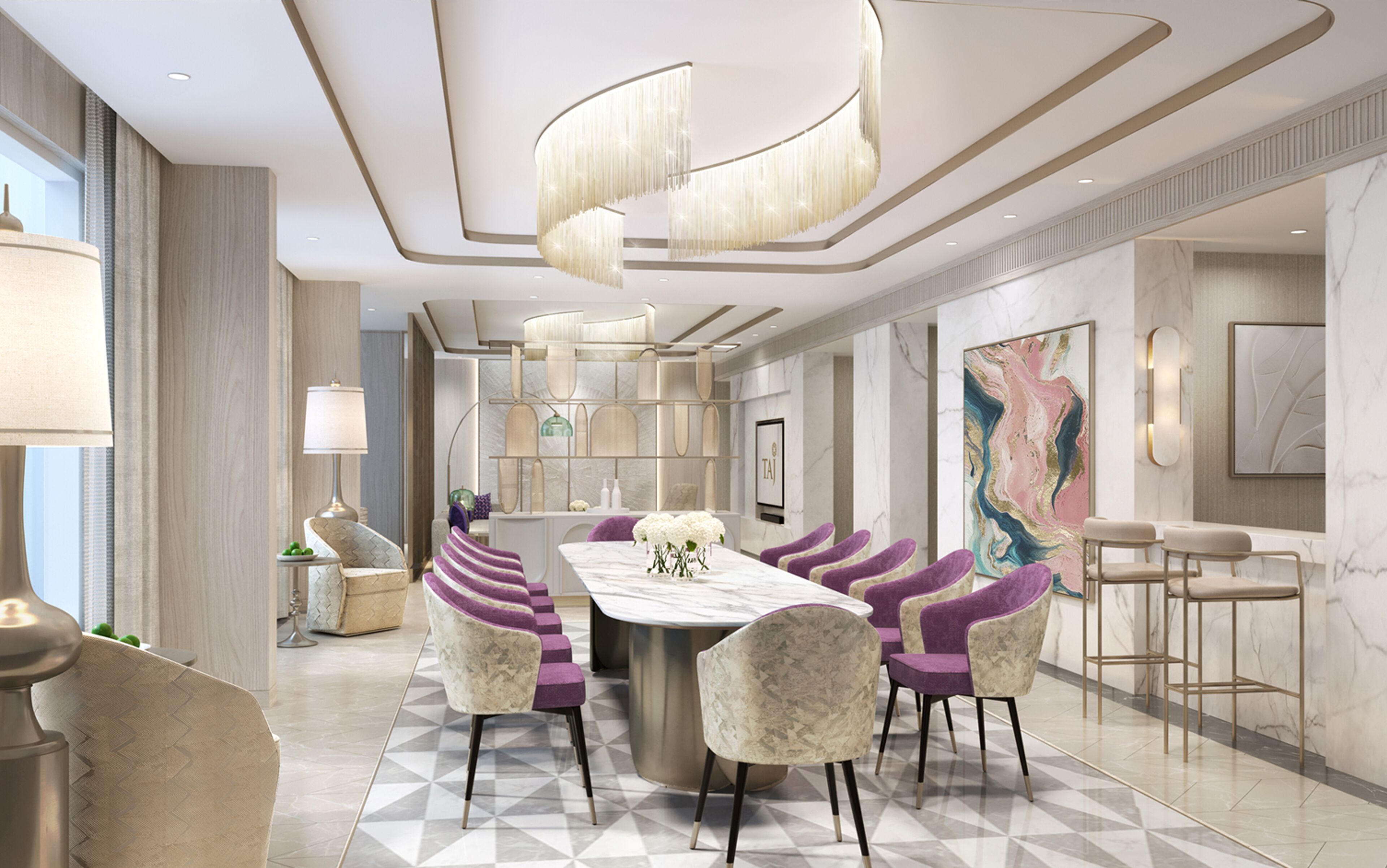 Un moderno hall de hotel con un mostrador de recepción de mármol, sillones tapizados en color morado y un cuadro abstracto de gran tamaño en la pared.