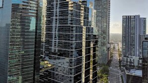A high-rise building with a modern glass facade, surrounded by other tall buildings. - Ocean&City Views Lux Miami Brickell Sleeps 4 KngBd (Miami)