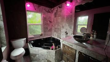 Shower, jetted tub, towels, soap