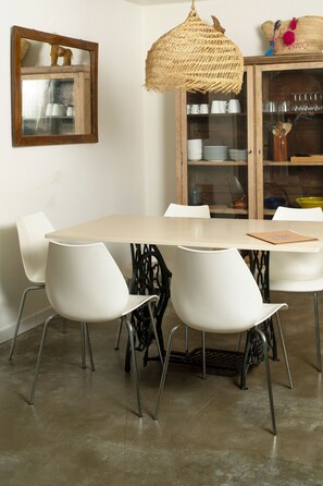 Enjoy meals in style at this dining area with a sleek table and six modern chairs.