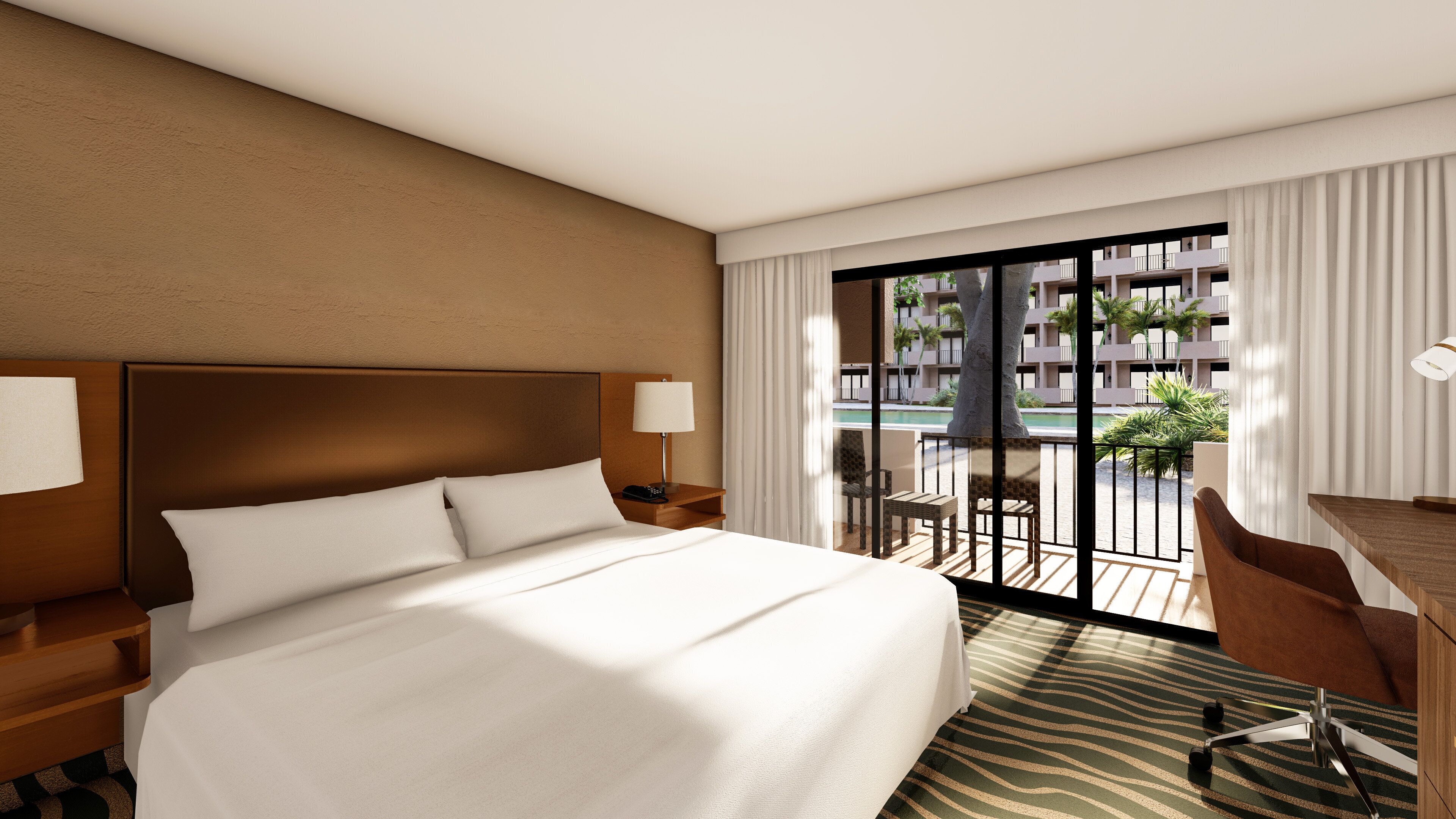 A hotel room with a large bed, a desk with a chair, a nightstand, and a view of a pool and buildings.