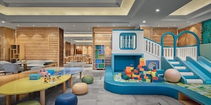 A children's play area with a slide, play structures, and seating. - Crowne Plaza Dongying by IHG (Dongying)