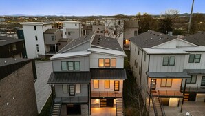 A residential area with modern houses, a visible garage, and a clear view of the surrounding neighborhood.