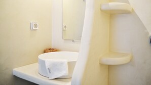 A bathroom with a white sink, a mirror, and a shower curtain. - Krotiri View of Paros (Paros)