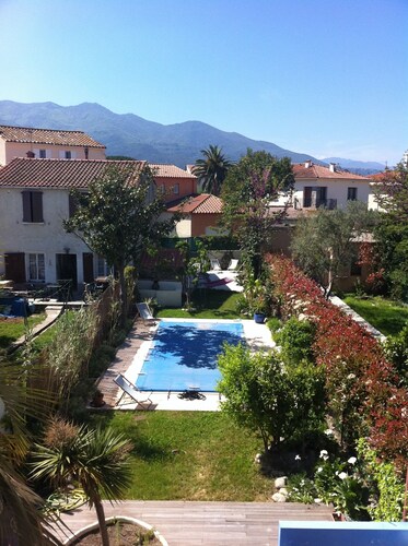 Pretty village house with private pool in rear garden. Opposite historic church.