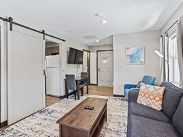 2 Queen Beds, 1-Bedroom Suite, Living Room, Non-Smoking | Desk, laptop workspace, blackout drapes, iron/ironing board