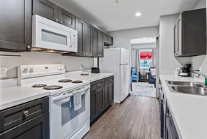 2 Queen Beds, 1-Bedroom Suite, Living Room, Non-Smoking | Desk, laptop workspace, blackout drapes, iron/ironing board - Baymont by Wyndham Ocala Suites (Ocala)