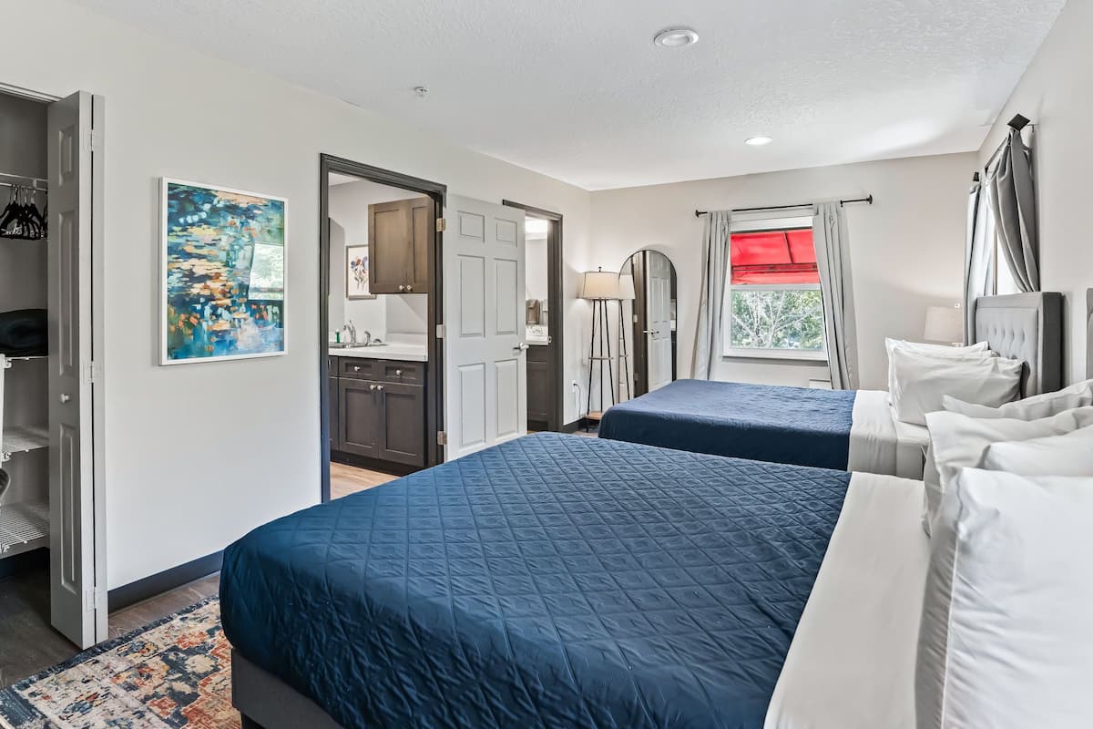 Suite, 2 Bedrooms, Non Smoking | Desk, laptop workspace, blackout curtains, iron/ironing board