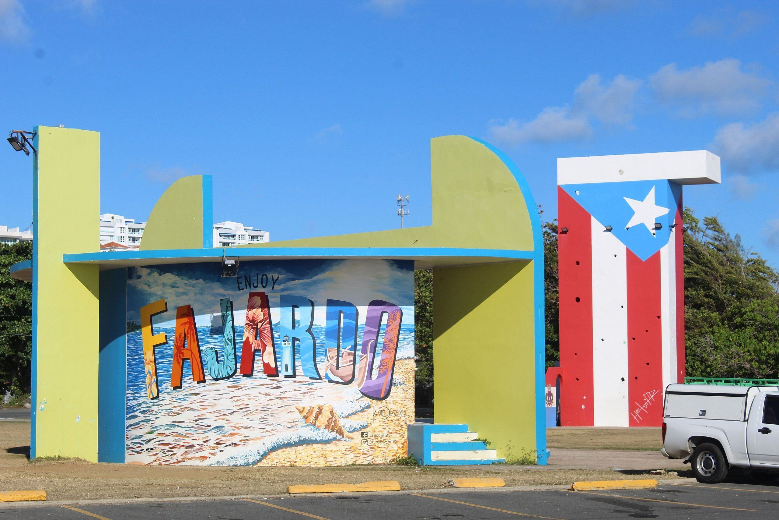 A colorful mural with the word "FAZARDO" and a beach scene.