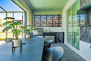 Outdoor dining - Magical 5BR Villa – Avengers Game Room, Themed Rooms & Pool w/ Summer Kitchen (Davenport)