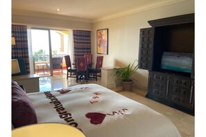 Relax in this stylish room with a large bed, flat-screen TV, and seating area, plus a balcony offering a view of the outdoors.