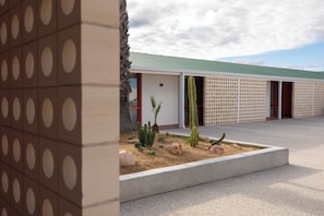 A building with a green roof, a cactus garden, and a patterned wall. - The Monty (Anglesea)
