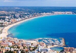Overlooking the beach, this property offers stunning views of the coastal city.