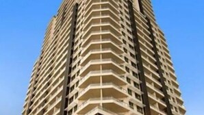 A high-rise hotel with multiple balconies, a central entrance, and a visible restaurant area. - Pandanas Apt 1 (U will love it) (Darwin City)