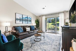 Condo, 1 King Bed with Sofa bed, Patio, Golf View (Vansen's Golfshores) | Living area | 65-inch flat-screen TV with digital channels