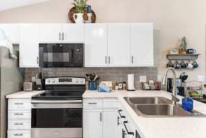 Condo, 1 King Bed with Sofa bed, Patio, Golf View (Vansen's Golfshores) | Private kitchen | Coffee/tea maker